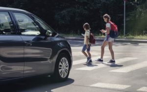pedestrians using a crosswalk at an intersection