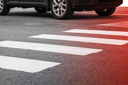 Car too close to a pedestrian crosswalk in Florida.