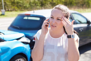 A woman calls her attorney after a car accident in Tarpon Springs, FL.