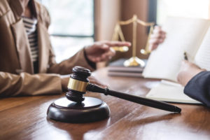 Injured woman consulting slip and fall lawyer.