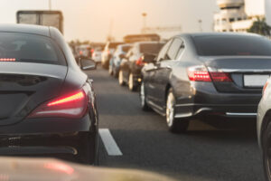 Black car using turn signal to show they want to change lanes.