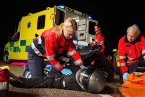 Paramedics rescuing motorcycle rider accident.