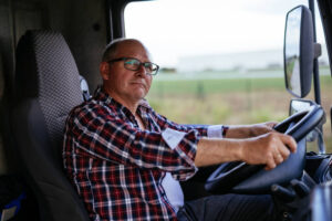 Truck driver cautiously driving safely.