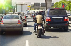 Motorcycle lane splitting the highway.