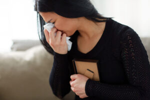 Widow crying in the wake of her husband.