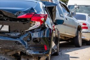 Three cars collided in the highway.