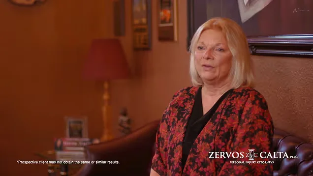 Client video testimonial: a woman in a red blouse