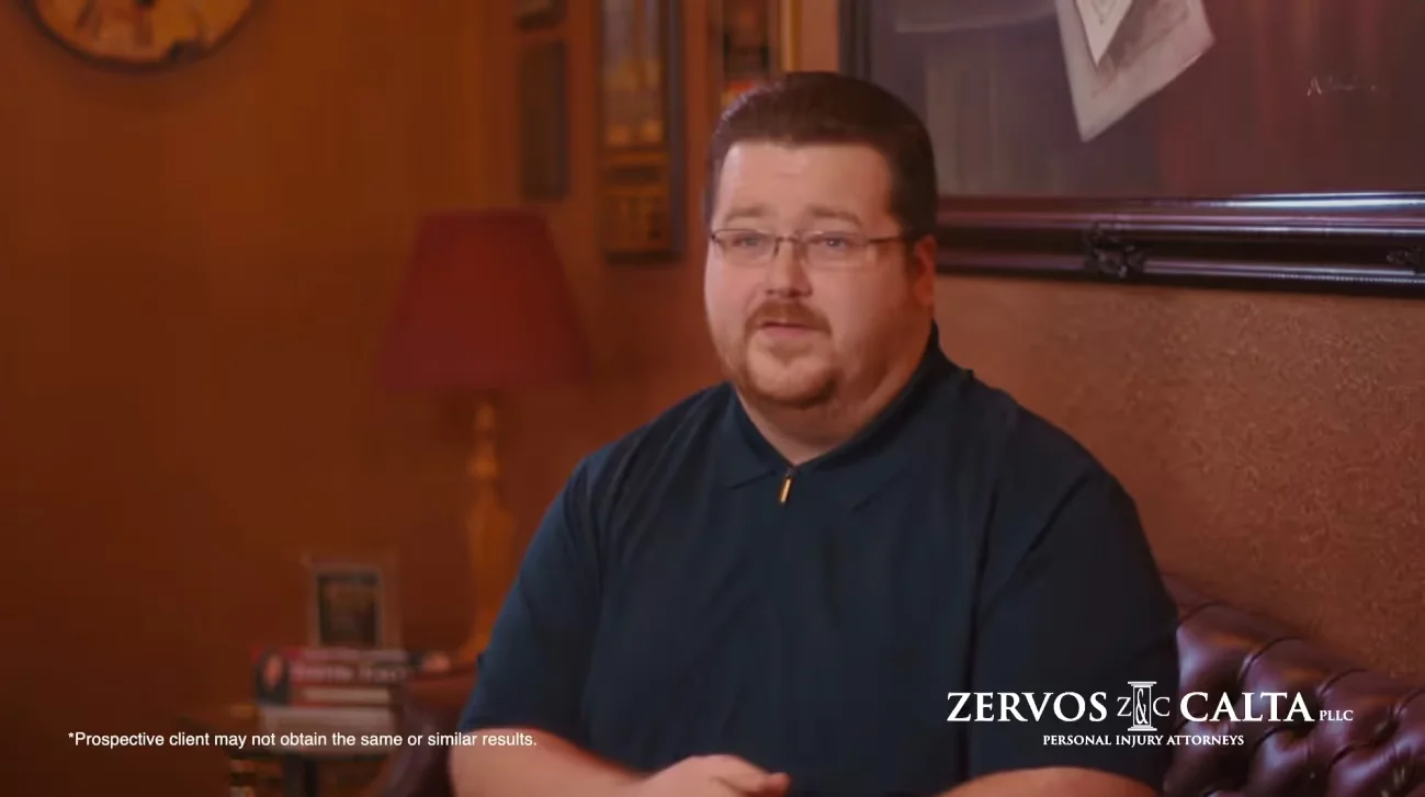 Client video testimonial: a man in a dark shirt